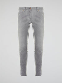 Elevate your denim game with these Grey Fringe Detailed Jeans from Roberto Cavalli. With intricate fringe detailing down the sides, these jeans offer a modern twist on a classic wardrobe staple. Pair them with a sleek top and statement heels for a look that's sure to turn heads.