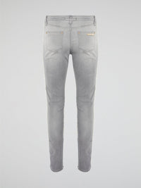 Elevate your denim game with these Grey Fringe Detailed Jeans from Roberto Cavalli. With intricate fringe detailing down the sides, these jeans offer a modern twist on a classic wardrobe staple. Pair them with a sleek top and statement heels for a look that's sure to turn heads.