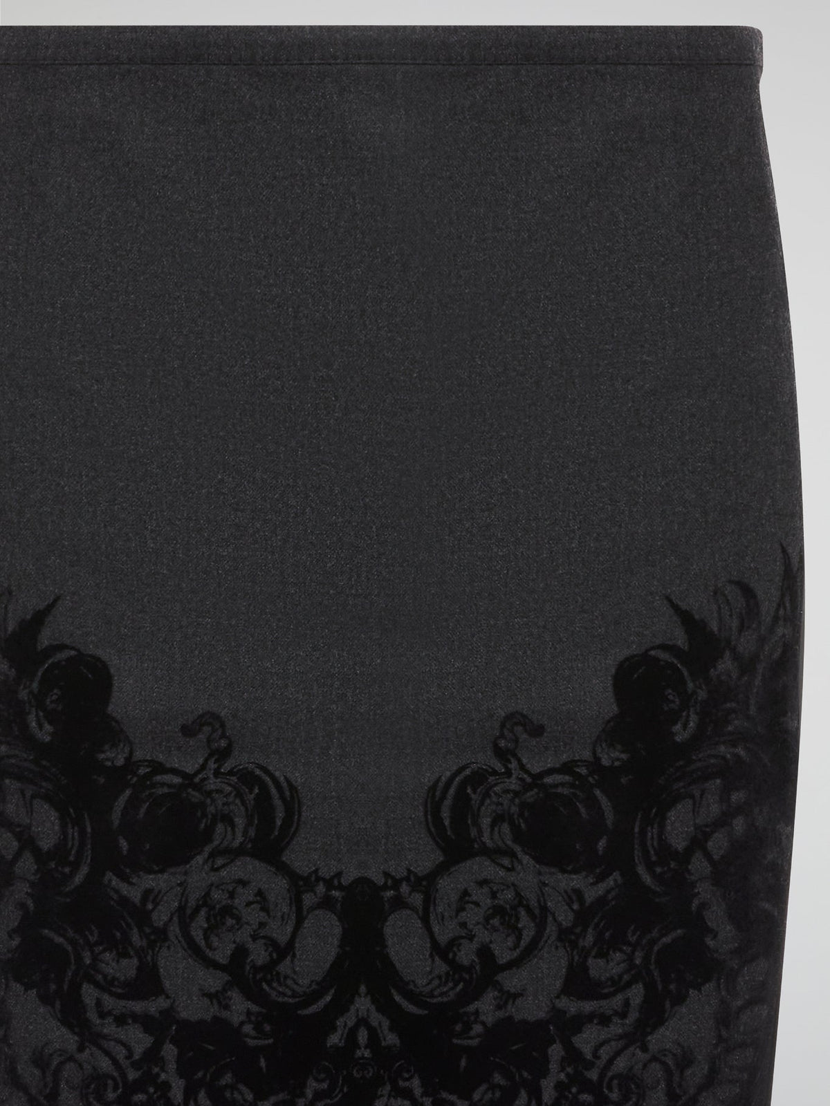 Elevate your office attire with this stunning grey printed pencil skirt from iconic designer Roberto Cavalli. The intricate pattern adds a touch of sophistication and style, making you stand out from the crowd. Pair it with a crisp white blouse and heels for a polished and fashion-forward look that will turn heads wherever you go.