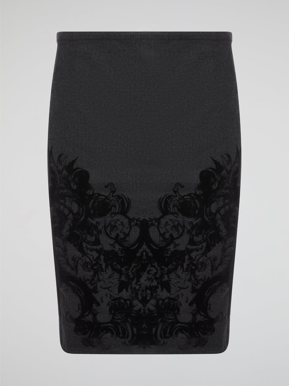 Elevate your office attire with this stunning grey printed pencil skirt from iconic designer Roberto Cavalli. The intricate pattern adds a touch of sophistication and style, making you stand out from the crowd. Pair it with a crisp white blouse and heels for a polished and fashion-forward look that will turn heads wherever you go.