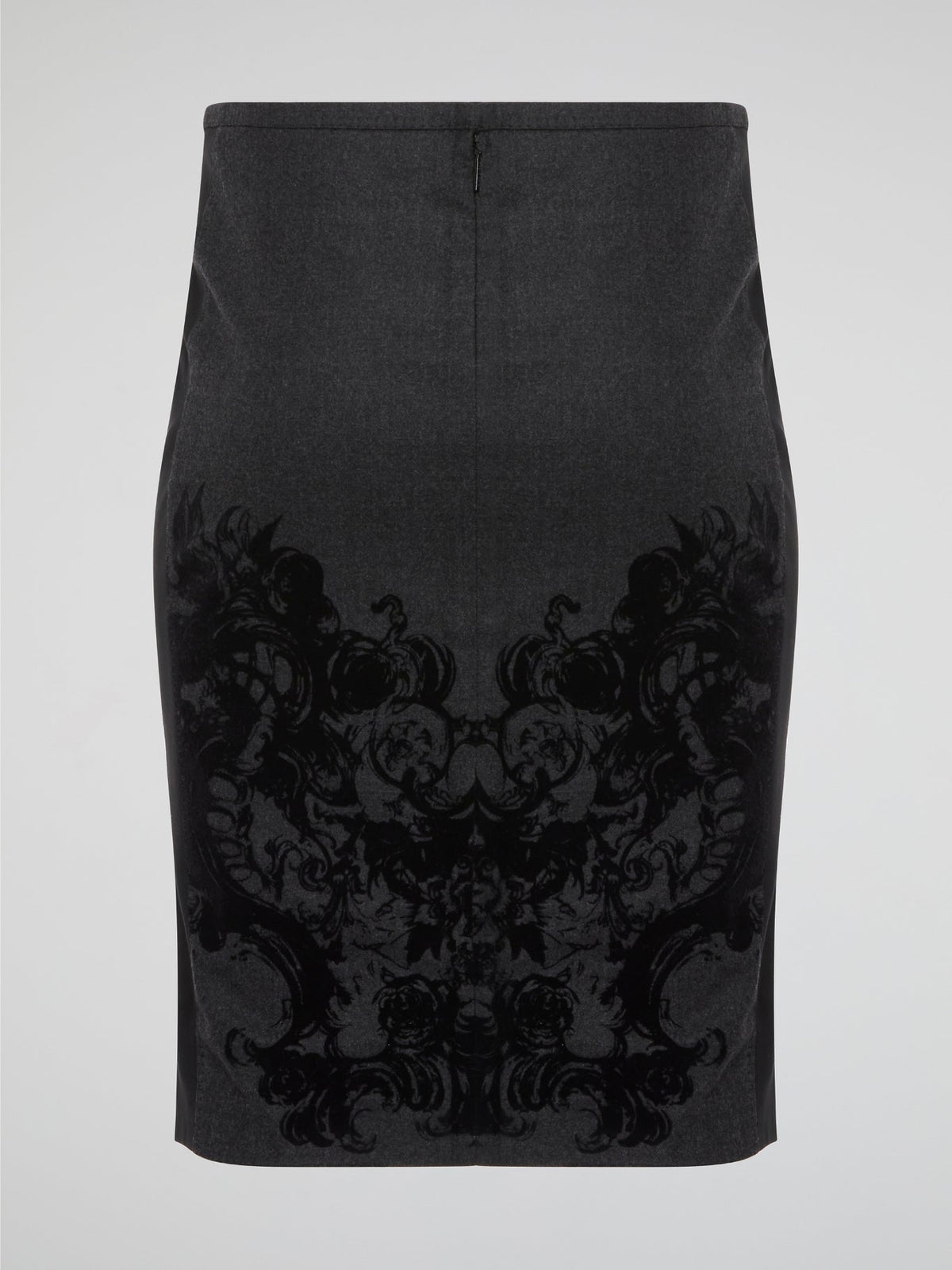 Elevate your office attire with this stunning grey printed pencil skirt from iconic designer Roberto Cavalli. The intricate pattern adds a touch of sophistication and style, making you stand out from the crowd. Pair it with a crisp white blouse and heels for a polished and fashion-forward look that will turn heads wherever you go.