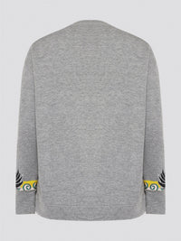 Elevate your casual wardrobe with this effortlessly chic Grey Embroidered Sweatshirt from Roberto Cavalli. Crafted with intricate floral embroidery, this sweatshirt adds a touch of luxury to your everyday look. Pair it with jeans for a stylish and comfortable outfit that will turn heads wherever you go.