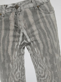 Step into the wild side of fashion with Roberto Cavalli's Animal Print Jeans, a fierce and daring addition to your denim collection. Crafted with impeccable precision, these jeans effortlessly fuse a touch of untamed allure with a classic silhouette. Showcasing the iconic Cavalli style, these statement pieces promise to bring out your inner fashion predator wherever you go.