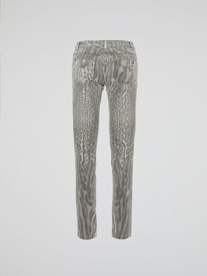 Step into the wild side of fashion with Roberto Cavalli's Animal Print Jeans, a fierce and daring addition to your denim collection. Crafted with impeccable precision, these jeans effortlessly fuse a touch of untamed allure with a classic silhouette. Showcasing the iconic Cavalli style, these statement pieces promise to bring out your inner fashion predator wherever you go.