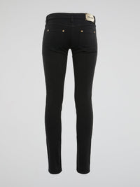 Elevate your style with these sleek and edgy Black Skinny Jeans by Roberto Cavalli - crafted for the fashion-forward individual who isn't afraid to make a bold statement. The figure-hugging fit and luxe detailing will have heads turning wherever you go, effortlessly taking you from day to night in style. Embrace your inner trendsetter with these must-have jeans that exude confidence and sophistication.