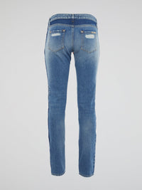 Wrap yourself in urban-chic style with our Scarf Belted Distressed Denim Jeans by Roberto Cavalli. The statement scarf belt adds a touch of bohemian flair to these edgy jeans, perfect for the fashion-forward individual. Stand out from the crowd and make a lasting impression with this unique and personal denim piece.