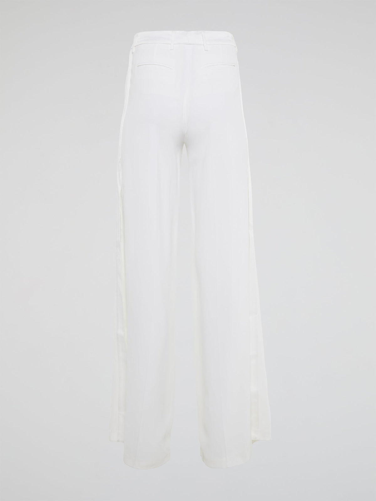 Elevate your style with these stunning white palazzo pants from Roberto Cavalli, designed to make you stand out from the crowd. The luxurious fabric drapes elegantly as you move, creating a sophisticated silhouette that is both comfortable and chic. Perfect for a day at the beach or a night on the town, these palazzo pants are a must-have addition to your wardrobe.