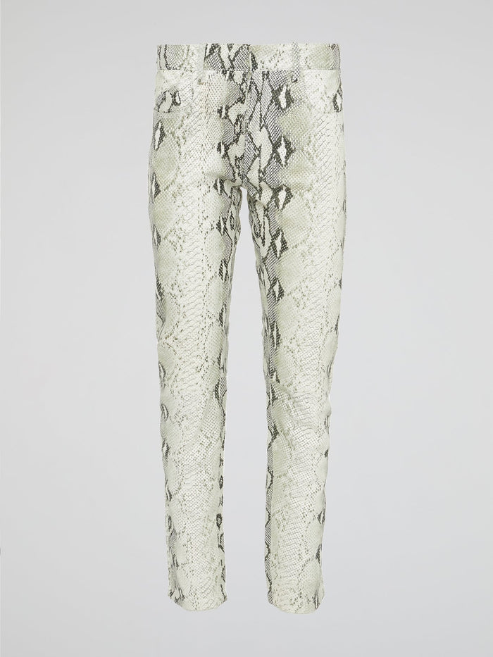 Infuse your wardrobe with a touch of wild sophistication with these snake print skinny trousers from Roberto Cavalli. Crafted from luxurious fabric, these statement pants will elevate any outfit from basic to bold in an instant. Step out in style and turn heads wherever you go with these modern, edgy trousers that exude confidence and glamour.