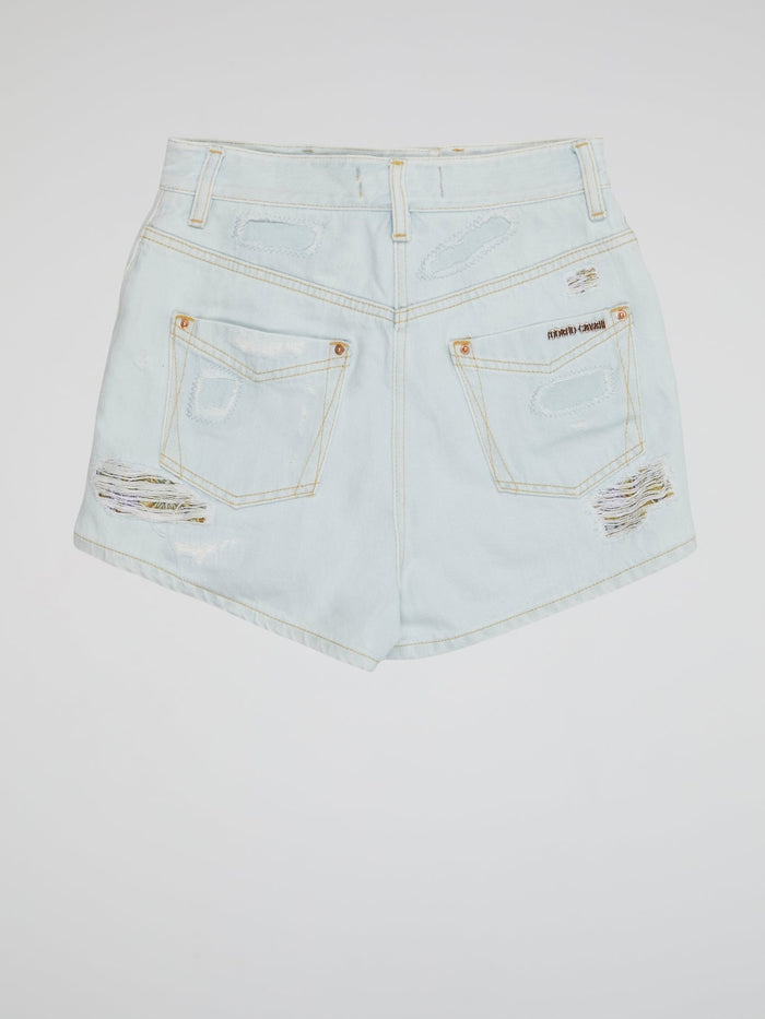 Embrace your inner rebel with our Blue Distressed Denim Shorts by Roberto Cavalli- perfect for any daring fashionista looking to make a statement. With a worn-in look and edgy vibes, these shorts are sure to turn heads wherever you go. From music festivals to beach days, these shorts are a must-have addition to your wardrobe for a bold and fearless style.