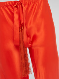 Unleash your inner goddess with these stunning Red Silk Palazzo Pants by Roberto Cavalli. Walk confidently in the flowing silk fabric that drapes elegantly around your legs, exuding luxury and sophistication. Turn heads wherever you go with the bold red color that demands attention and leaves a lasting impression.