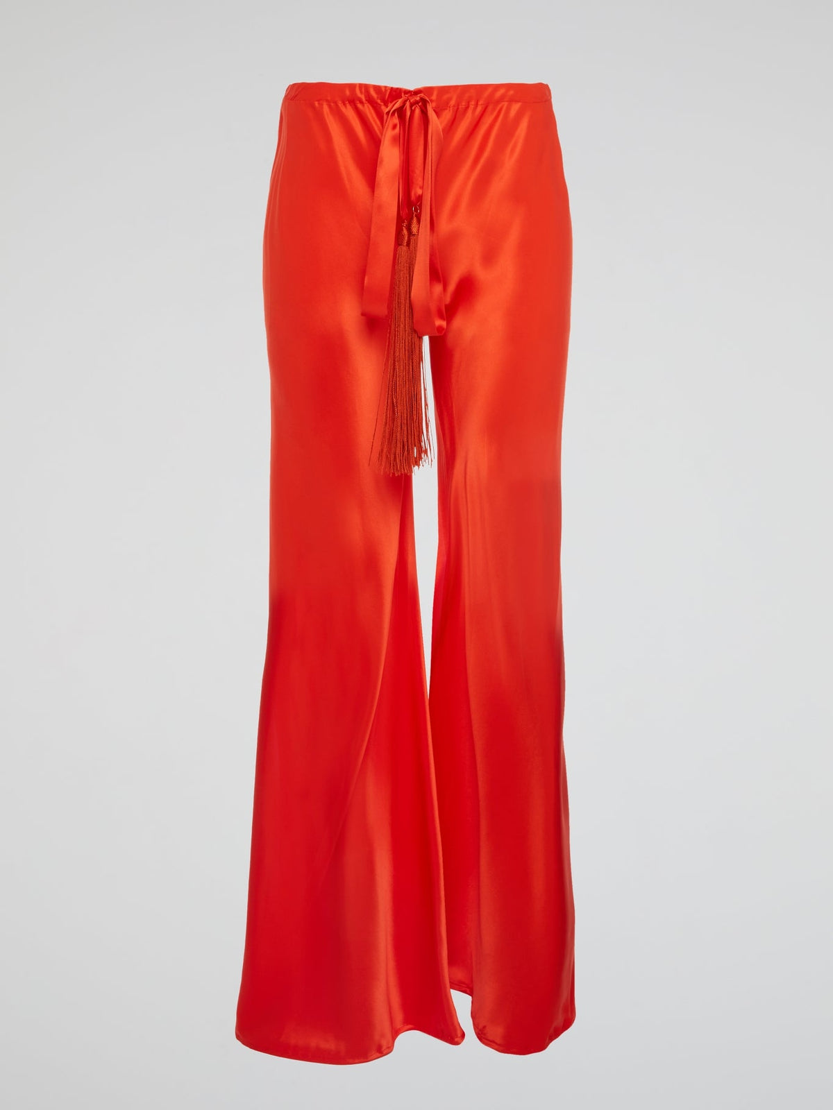 Unleash your inner goddess with these stunning Red Silk Palazzo Pants by Roberto Cavalli. Walk confidently in the flowing silk fabric that drapes elegantly around your legs, exuding luxury and sophistication. Turn heads wherever you go with the bold red color that demands attention and leaves a lasting impression.