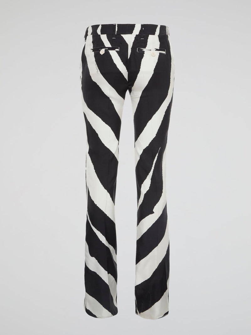 Unleash your wild side with these stunning zebra print wide leg pants from Roberto Cavalli. Made for the bold and the fearless, these pants will add a touch of exotic flair to your wardrobe. Embrace your inner fashionista and stand out from the crowd in these eye-catching statement pants.