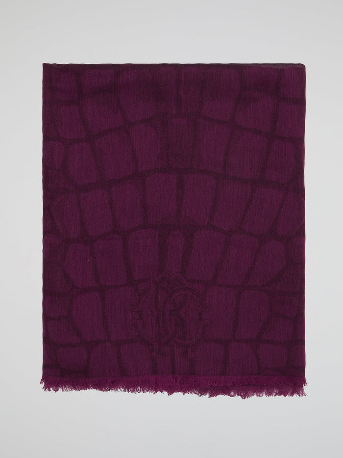 Wrap yourself in luxury with this stunning Burgundy Snake Print Scarf by Roberto Cavalli. Made from the finest materials, this scarf features a bold and captivating design that will elevate any outfit. Stand out from the crowd and exude confidence and style with this must-have accessory.