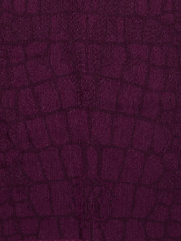 Wrap yourself in luxury with this stunning Burgundy Snake Print Scarf by Roberto Cavalli. Made from the finest materials, this scarf features a bold and captivating design that will elevate any outfit. Stand out from the crowd and exude confidence and style with this must-have accessory.