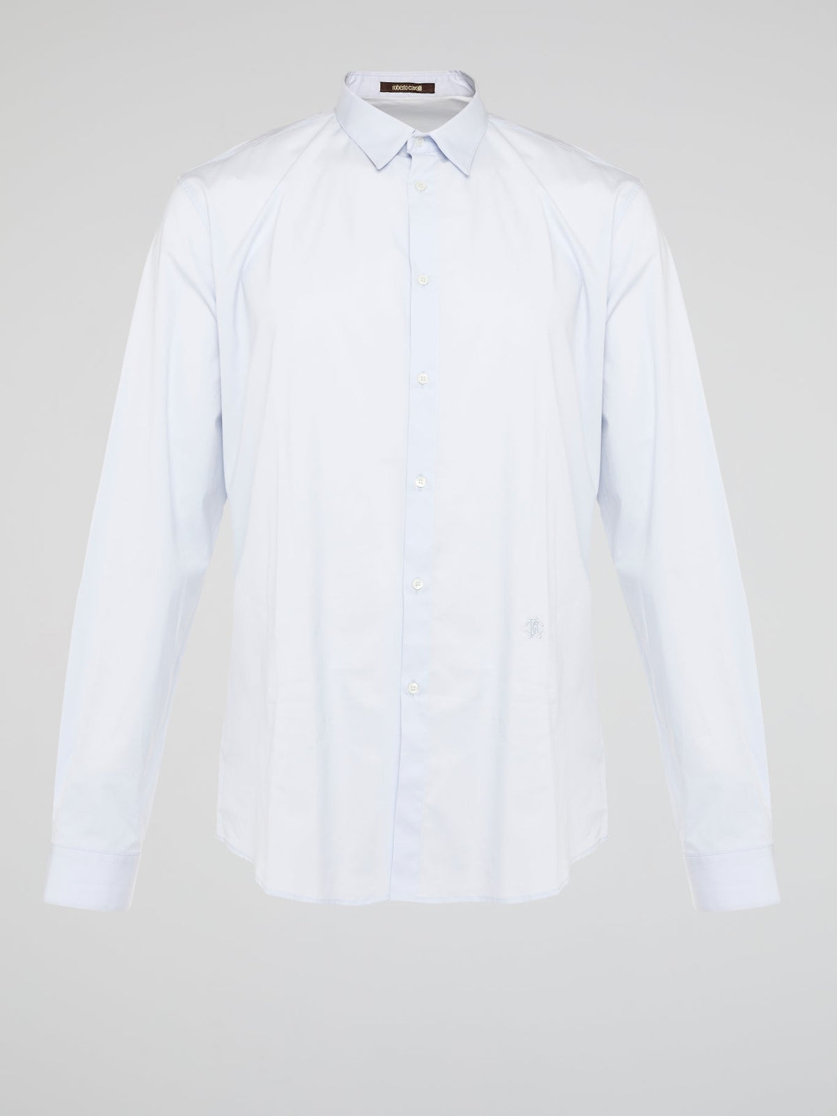 Elevate your wardrobe with the effortlessly chic White Long Sleeve Shirt by Roberto Cavalli. Crafted from luxurious fabric with impeccable attention to detail, this versatile piece exudes sophistication and glamour. Embrace a timeless look that seamlessly transitions from day to night with this must-have staple.