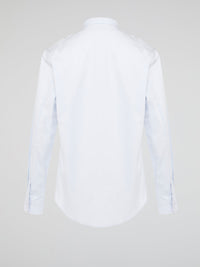 Elevate your wardrobe with the effortlessly chic White Long Sleeve Shirt by Roberto Cavalli. Crafted from luxurious fabric with impeccable attention to detail, this versatile piece exudes sophistication and glamour. Embrace a timeless look that seamlessly transitions from day to night with this must-have staple.