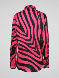 Let your wild side shine with this stunning Pink Zebra Print Shirt by Roberto Cavalli, crafted for the fashion-forward individual who dares to stand out from the crowd. Made with luxurious materials and impeccable attention to detail, this shirt is a bold statement piece that exudes confidence and style. Embrace your inner fashionista and make heads turn wherever you go with this eye-catching and trendy wardrobe essential.