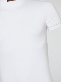 Indulge in luxury with the White Ribbed Trim T-Shirt by Roberto Cavalli Underwear, a sleek and stylish addition to your wardrobe that effortlessly combines comfort and sophistication. Crafted with the finest materials and detailed with ribbed trim, this t-shirt exudes timeless elegance and modern charm. Elevate your everyday look with this must-have piece that promises to make a statement wherever you go.