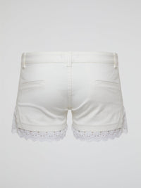 Embrace your inner bohemian goddess with these White Lace Trim Shorts by Roberto Cavalli. The delicate lace detailing adds a touch of elegance to these flowy shorts, perfect for a summer music festival or beach day. Channel your inner free spirit and stand out in style with this must-have addition to your wardrobe.