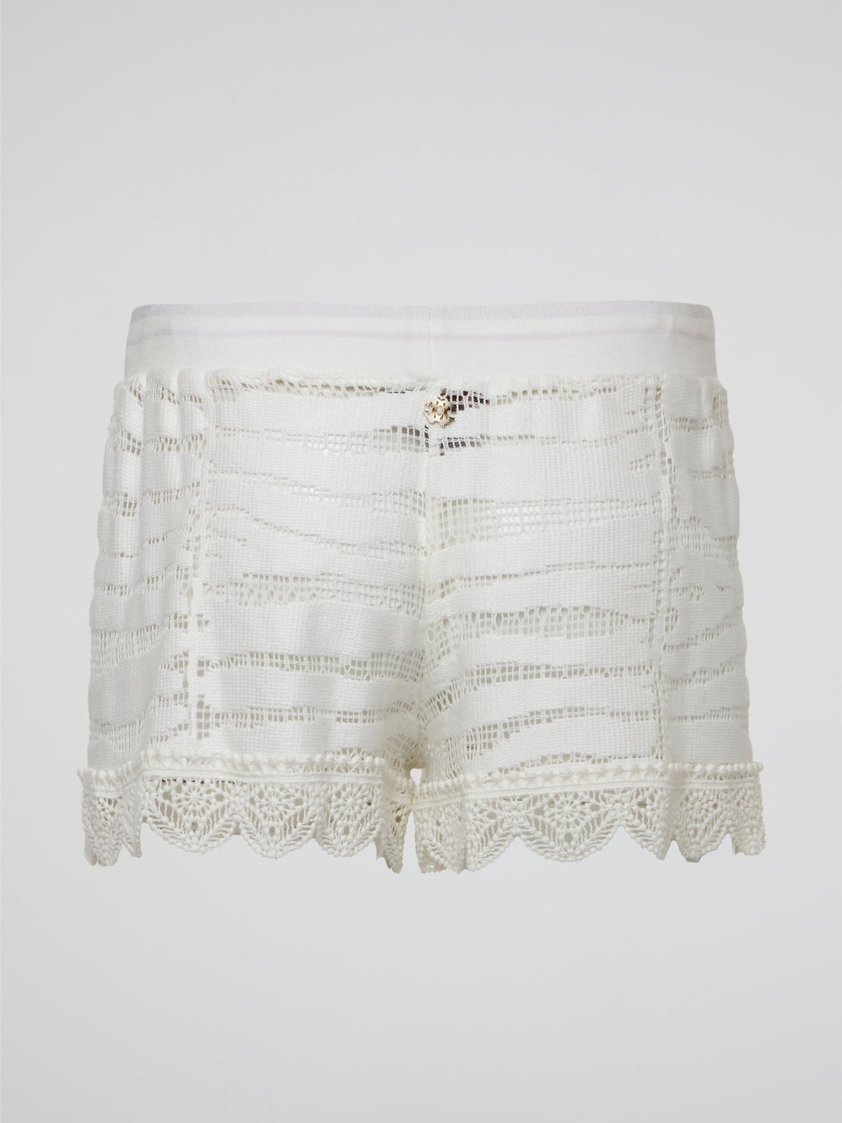 Elevate your summer wardrobe with these stunning white knitted shorts by Roberto Cavalli, perfect for lounging by the pool or a chic brunch with friends. Crafted with impeccable attention to detail, these shorts effortlessly blend comfort and style for a truly luxurious feel. Embrace your inner fashionista and make a statement with these must-have shorts that are sure to turn heads wherever you go.