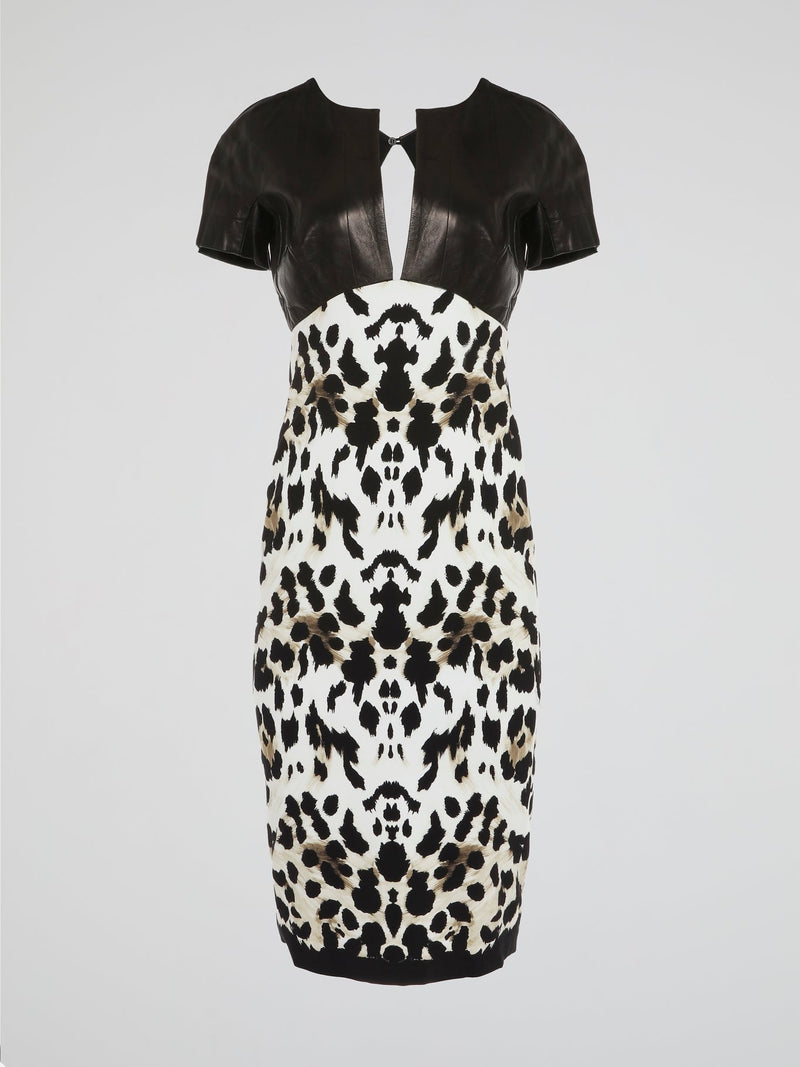 Make a fierce fashion statement with this Animal Print Leather Panel Dress by Roberto Cavalli. Unleash your inner wild side with its daring leopard print design, combined with luxurious leather panels that exude confidence and allure. This stunning dress combines elegance and edginess, making it the perfect choice for any glamorous occasion.