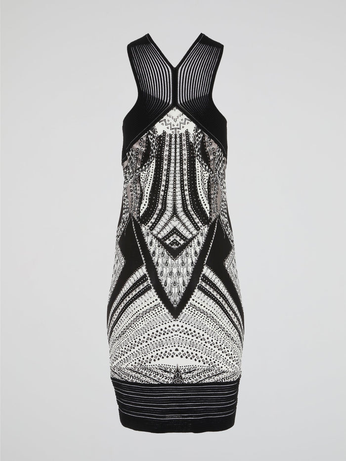 This Tribal Print Sleeveless Dress by Roberto Cavalli merges the wild spirit of nature with the elegance of high fashion. Its vibrant and intricate tribal patterns transport you to faraway lands, while the sleek and effortless silhouette ensures a showstopper look. Indulge in this masterpiece that captures the essence of adventure and sophistication in every stitch.