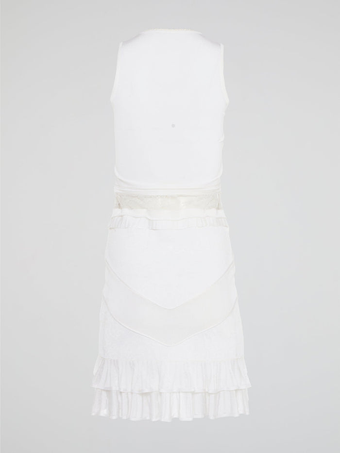 The White Ruffle Dress by Roberto Cavalli will transport you to dreamy summer nights with its ethereal charm. Crafted with intricate layers of delicate ruffles, this dress effortlessly merges elegance with playfulness. From a casual garden party to a glamorous evening soir��e, this dress is guaranteed to turn heads and make you feel like a true goddess.