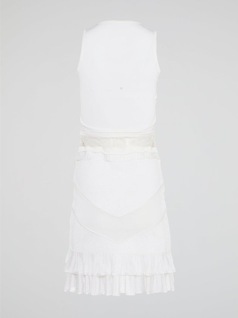 The White Ruffle Dress by Roberto Cavalli will transport you to dreamy summer nights with its ethereal charm. Crafted with intricate layers of delicate ruffles, this dress effortlessly merges elegance with playfulness. From a casual garden party to a glamorous evening soir��e, this dress is guaranteed to turn heads and make you feel like a true goddess.