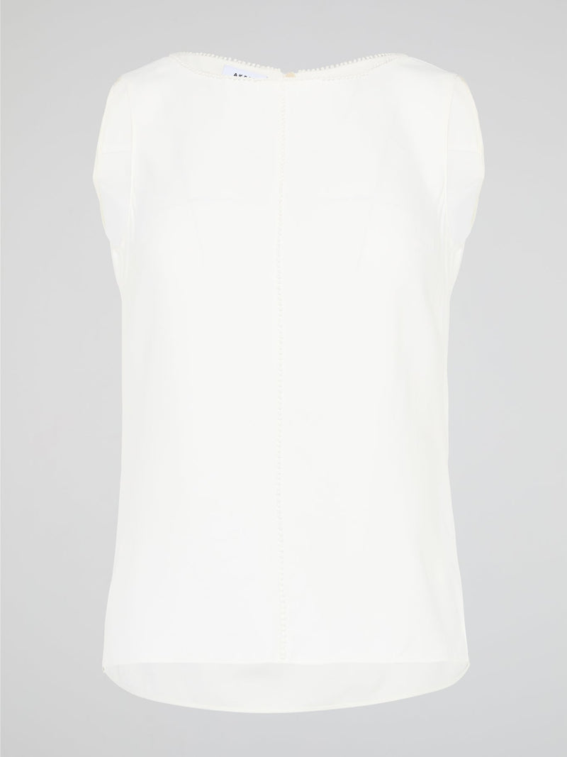 Introducing a timeless masterpiece for fashion-forward mavens - the White Sleeveless Top by Akris Punto. This ethereal beauty effortlessly combines sophistication and elegance with its minimalist design and impeccable tailoring. Crafted from luxurious fabrics, it's the perfect versatile piece to elevate your style, ensuring you're the epitome of chic from desk to dinner.