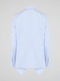 Introducing the Powder Blue High-Low Shirt by Akris Punto, where elegance meets contemporary style. Delicate powder blue hue cascades down the front, enveloping you in a calming wave of tranquility. With its unique high-low hemline and luxurious fabric, this shirt effortlessly elevates any outfit, making it a must-have piece for the fashion-forward trendsetters.