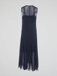 Step into elegance and grace with our Navy Pleated Maxi Dress from Akris Punto. Crafted with meticulous attention to detail, this dress showcases a flattering pleated design that beautifully flows with every step. Perfect for both formal occasions and casual outings, it's time to make a statement and be the epitome of sophistication.