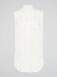 Unleash your fierce, fashion-forward side with the White Studded Sleeveless Shirt by Akris Punto. Crafted with meticulous attention to detail, this statement piece is adorned with intricately placed studs that exude edgy sophistication. Perfectly blending poise and rebellious spirit, this sleeveless shirt is a captivating must-have for those seeking to redefine their style game.