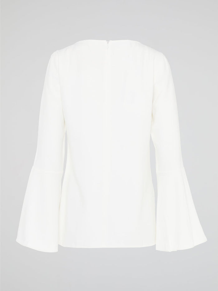 Elevate your everyday look with the White Flared Sleeve Top by Akris Punto. This contemporary and chic piece features unique flared sleeves that add a playful twist to your outfit. Made with high-quality materials, this top guarantees comfort and style, making it a must-have addition to your wardrobe.