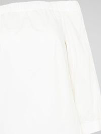 Elevate your summer wardrobe with our White Off-Shoulder Top by Akris Punto. Embrace a touch of effortless elegance as the delicate fabric gracefully drapes off your shoulders, exuding femininity and style. With its versatile design, this top is perfect for both casual outings and special occasions, ensuring you always feel chic and glamorous wherever you go.