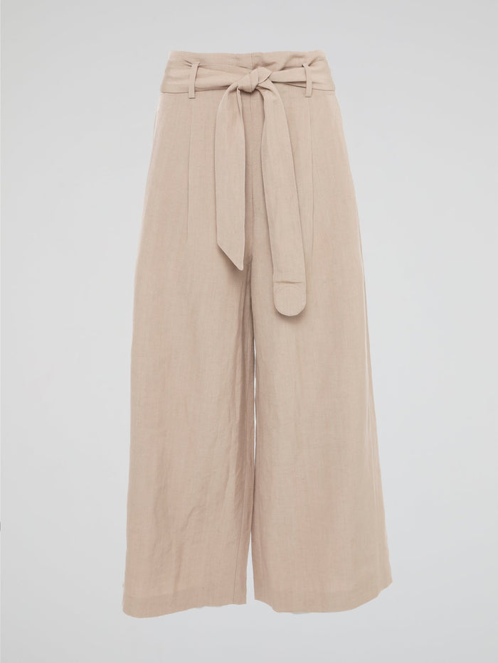 Elevate your style game with these Beige Belted Palazzo Pants from Akris Punto. Crafted with meticulous attention to detail, these pants feature a high-waisted, wide-leg silhouette that flatters every body type. The chic belted waist adds a touch of sophistication, making these pants the perfect choice for a day at the office or a stylish evening event.