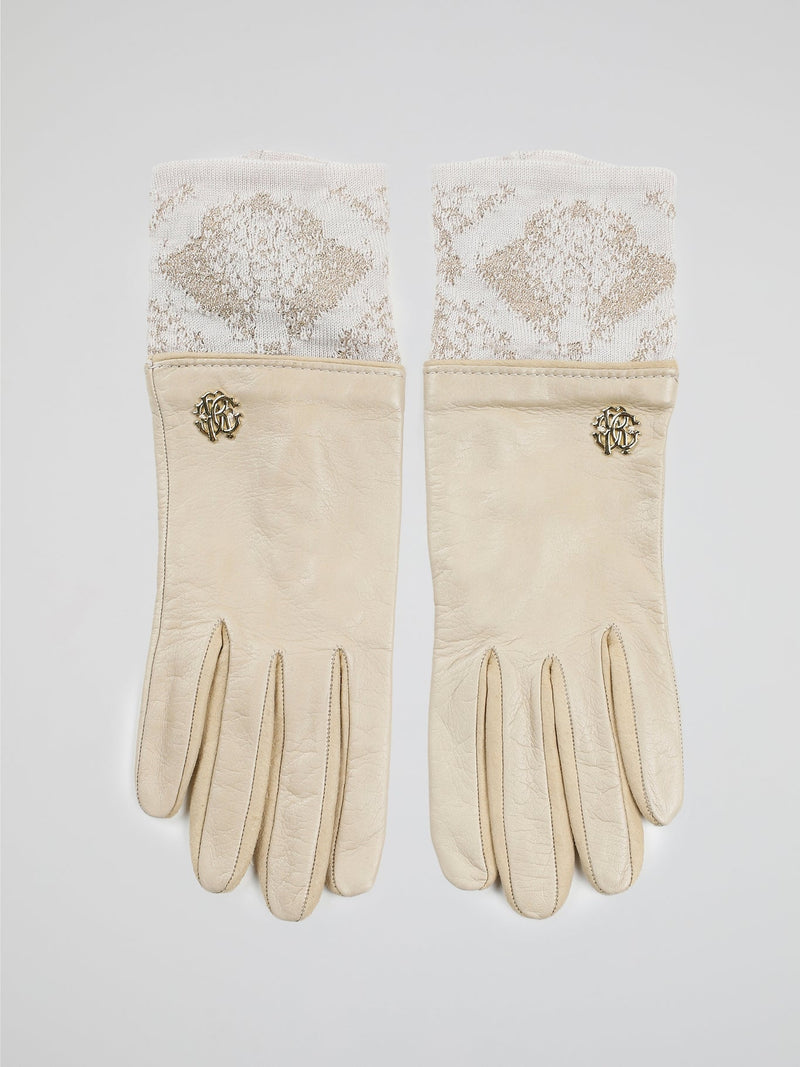 Step into luxury with these exquisite Beige Logo Embellished Gloves by Roberto Cavalli. Crafted with precision and elegance, these gloves feature the iconic Roberto Cavalli logo tastefully embellished on the fine beige leather. Whether you're strolling through the city or attending a glamorous event, these gloves will add a touch of opulence and sophistication to any outfit.