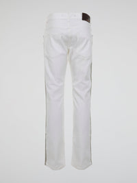 Step into the realm of high fashion with these White Studded Trousers by Roberto Cavalli. Made for those who dare to be different, these trousers feature meticulous studded details that add a touch of rebellious glamour. With their sleek design and luxurious fabric, they are the ultimate statement piece for any fashion-forward individual.