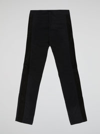 Step into elegance with these stunning Black Embellished Trousers by Roberto Cavalli. Crafted with meticulous care, each detail on these trousers tells a story of sophistication and luxury. From the delicate beaded embellishments to the figure-flattering silhouette, these trousers are a fashion statement that exudes confidence and style.