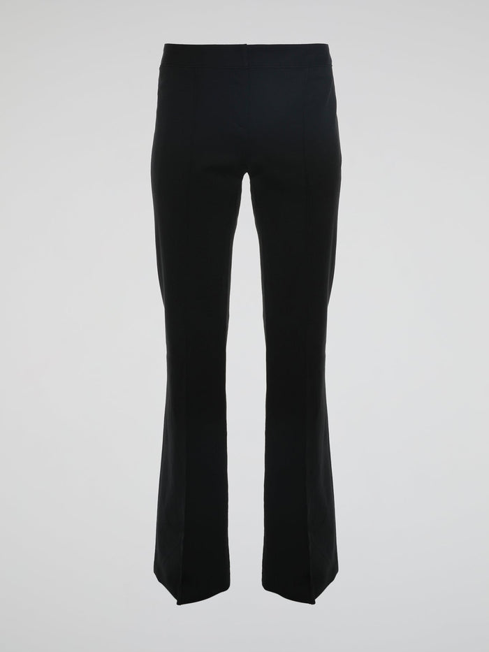 Step into the world of effortless glamour with these Black Flared Trousers by Roberto Cavalli. Crafted with meticulous precision, these trousers boast a striking silhouette that elegantly skims the figure, accentuating every curve. From the office to a night out, these trousers are a timeless wardrobe staple designed to make a bold fashion statement.