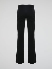 Step into the world of effortless glamour with these Black Flared Trousers by Roberto Cavalli. Crafted with meticulous precision, these trousers boast a striking silhouette that elegantly skims the figure, accentuating every curve. From the office to a night out, these trousers are a timeless wardrobe staple designed to make a bold fashion statement.