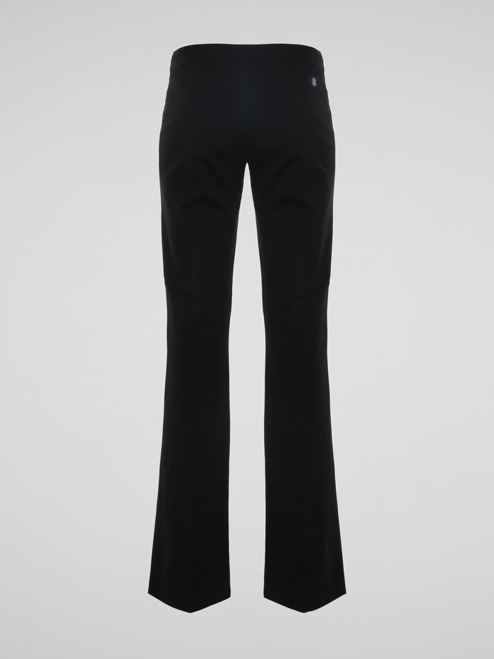 Step into the world of effortless glamour with these Black Flared Trousers by Roberto Cavalli. Crafted with meticulous precision, these trousers boast a striking silhouette that elegantly skims the figure, accentuating every curve. From the office to a night out, these trousers are a timeless wardrobe staple designed to make a bold fashion statement.