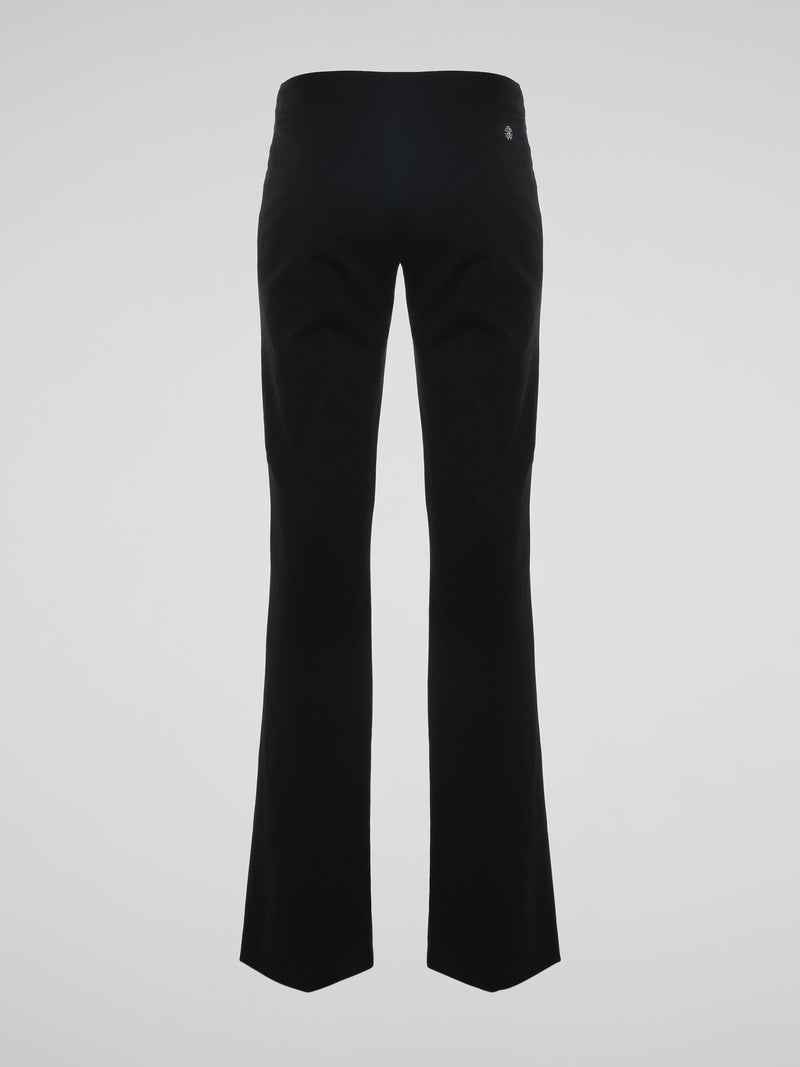 Step into the world of effortless glamour with these Black Flared Trousers by Roberto Cavalli. Crafted with meticulous precision, these trousers boast a striking silhouette that elegantly skims the figure, accentuating every curve. From the office to a night out, these trousers are a timeless wardrobe staple designed to make a bold fashion statement.