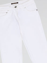 Turn heads and elevate your style with our White Straight Cut Jeans by Roberto Cavalli. Crafted with precision and attention to detail, these jeans feature a sleek and modern design that embodies sophistication and confidence. Whether you're strolling through the city or hitting the beach, these jeans are sure to make a statement and redefine your fashion game.