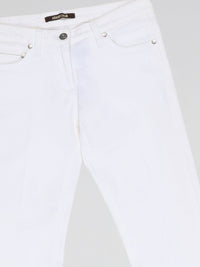 Step into fashion-forward elegance with these White Flared Jeans from renowned designer Roberto Cavalli. Crafted with meticulous attention to detail, these jeans feature a flattering high waistline and a mesmerizing flared silhouette that effortlessly elongates your legs. The pure white hue adds a touch of sophistication, making them the perfect statement piece for any occasion.