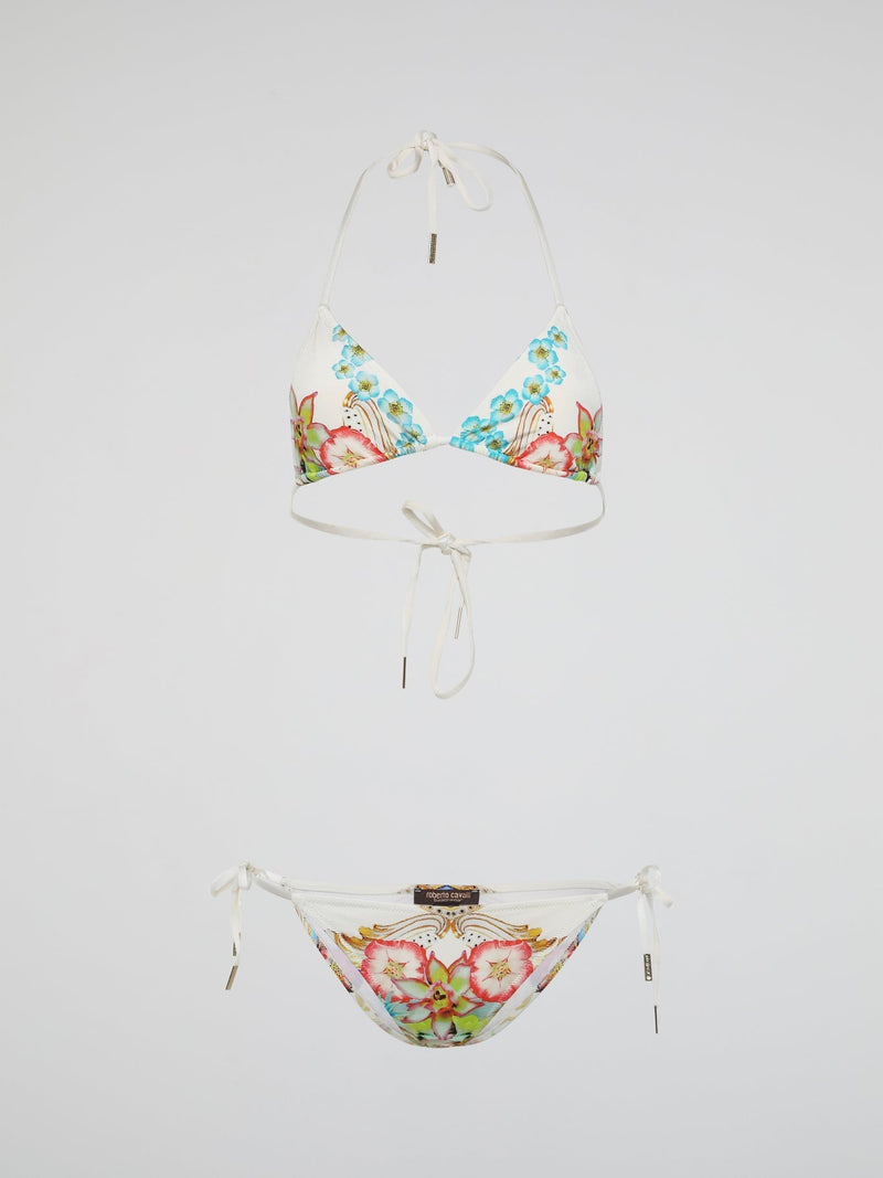 Dive into a garden of exotic elegance with Roberto Cavalli's Floral Print Swimwear. Inspired by the breathtaking beauty of blooming flowers, this collection features vibrant colors and intricate floral patterns that make a bold statement by the pool or beach. Crafted with the finest materials and impeccable attention to detail, each swimsuit radiates luxury and sophistication, allowing you to immerse yourself in a world of floral fantasy while making heads turn wherever you go.