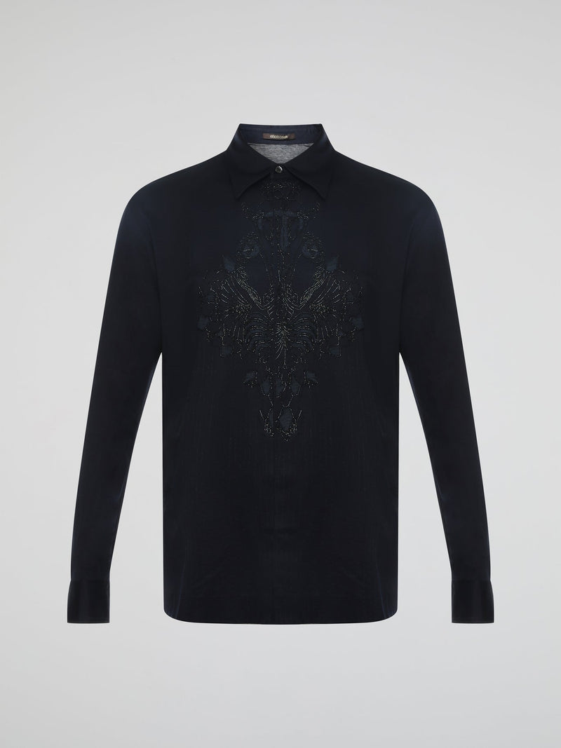 Step into the realm of effortless elegance with the captivating Black Embroidered Shirt by Roberto Cavalli. Adorned with intricate embroidery and delicate lace details, this shirt is a mesmerizing fusion of sophistication and sensuality. Elevate your style with this statement piece that exudes an air of mystique and timeless allure.