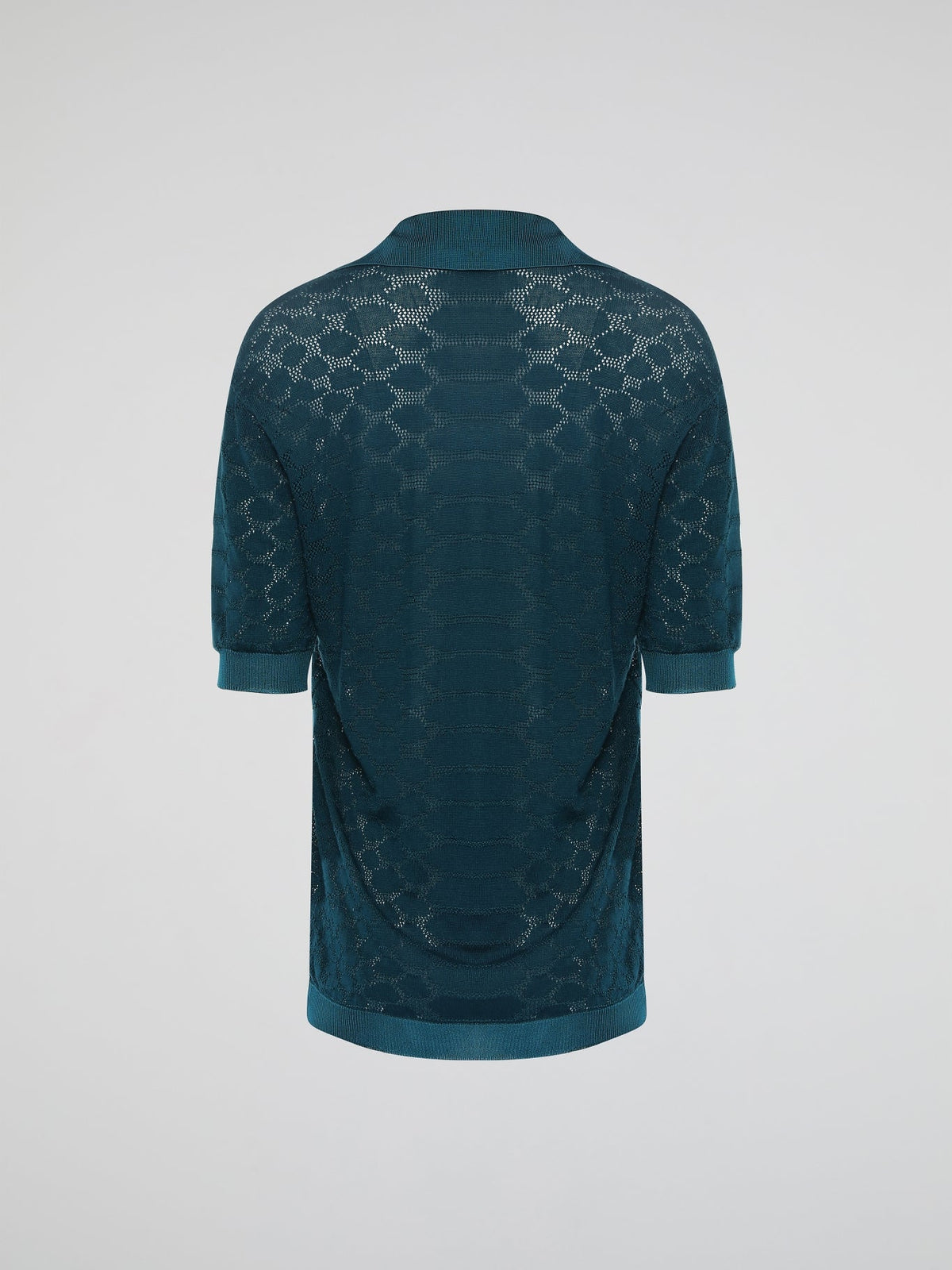 Step into the wild with the Green Reptilian Knitted Blouse by Roberto Cavalli ��� a mesmerizing blend of sophistication and untamed allure. Crafted with meticulous attention to detail, this alluring garment showcases a captivating reptilian-inspired pattern that dances as you move, making a statement wherever you go. Embrace your inner fashion predator and let this striking blouse unleash your fierce and fabulous style.
