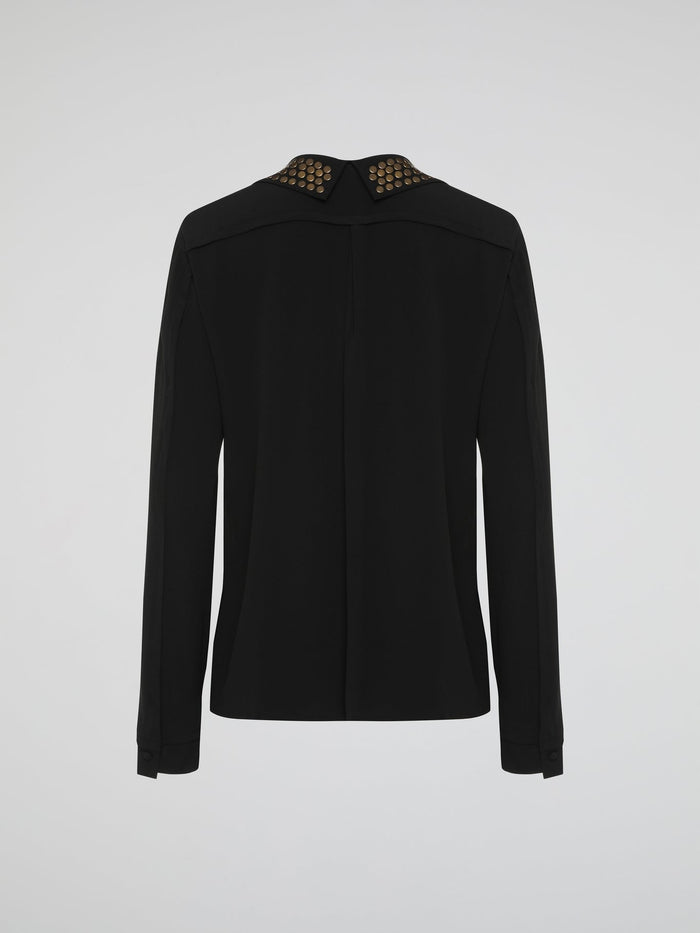 Step into the world of fierce elegance with the Black Studded Collar Blouse by Roberto Cavalli. This extraordinary piece effortlessly combines edgy appeal with timeless sophistication, making it a versatile addition to any wardrobe. With its luxurious fabric, daring studded collar, and impeccable craftsmanship, this blouse is a bold statement that exudes confidence and pushes boundaries.