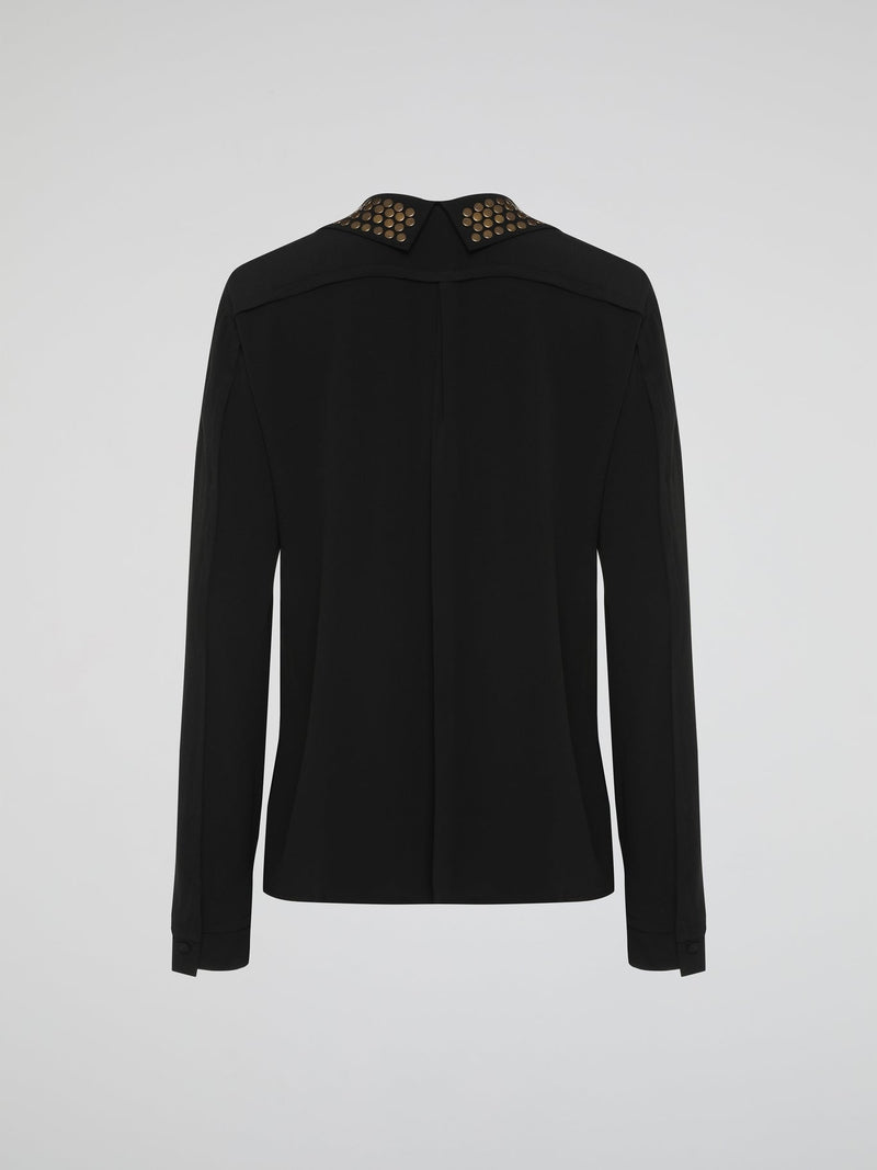 Step into the world of fierce elegance with the Black Studded Collar Blouse by Roberto Cavalli. This extraordinary piece effortlessly combines edgy appeal with timeless sophistication, making it a versatile addition to any wardrobe. With its luxurious fabric, daring studded collar, and impeccable craftsmanship, this blouse is a bold statement that exudes confidence and pushes boundaries.