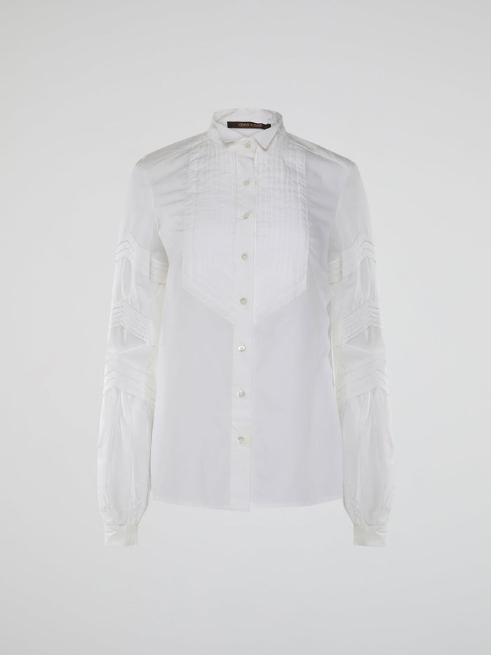 Step into the world of timeless elegance with the White Pleated Bib Shirt from Roberto Cavalli. Crafted with meticulous attention to detail, this masterpiece combines effortless sophistication with a touch of whimsical charm. From its delicate pleated bib to its crisp white fabric, this shirt will make a statement in any setting, exuding refined elegance that is truly captivating.